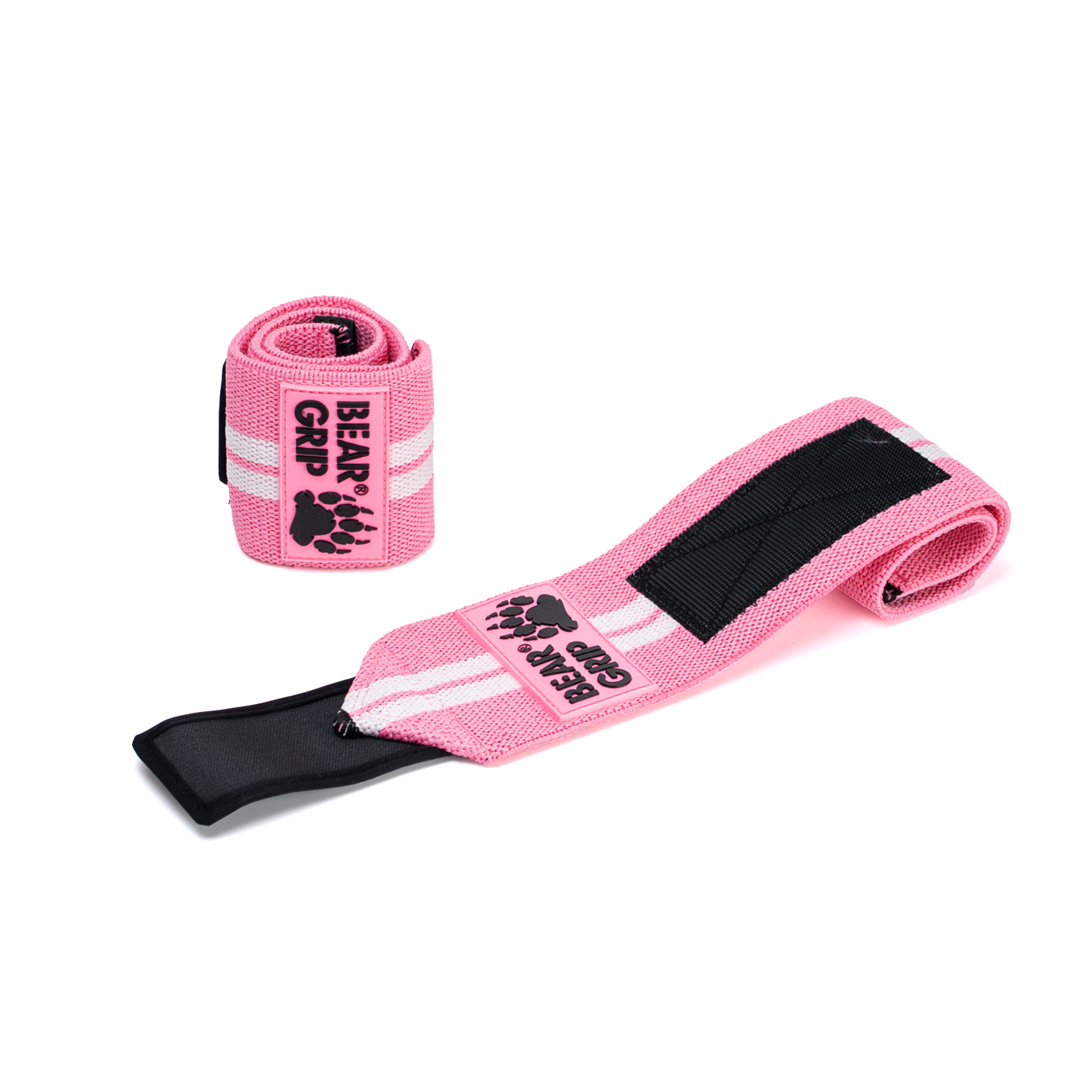 BEAR GRIP baby pink wrist wraps, one upright and one laid flat, with textured straps and logo patch on a white background.